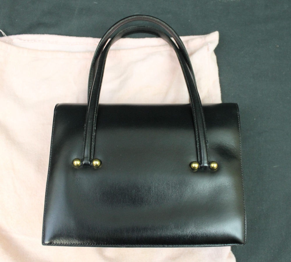 Lot 95 - Black leather vintage Hermés handbag with
